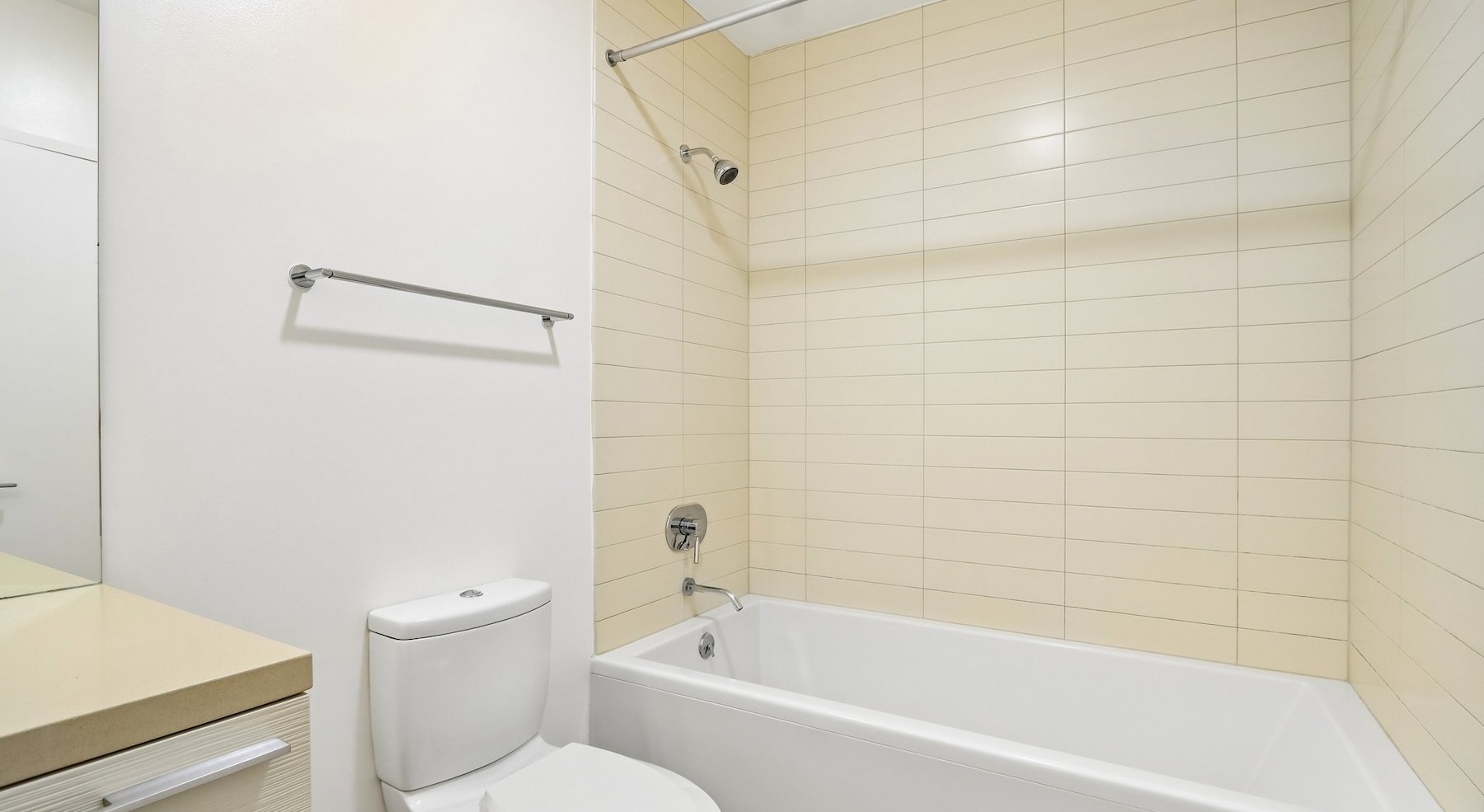 a bathroom with a tub, toilet and sink