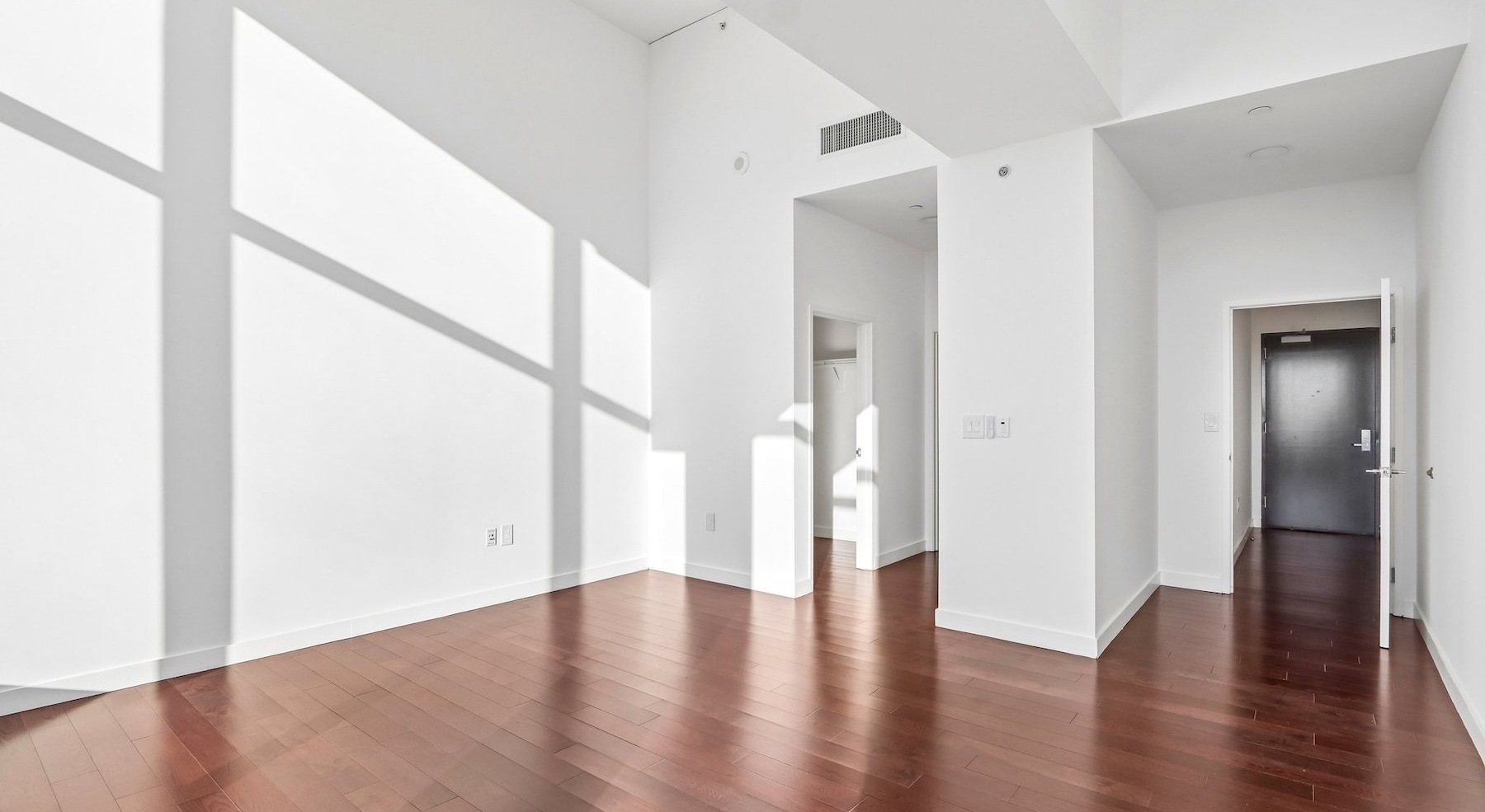 a room with white walls and wood floors