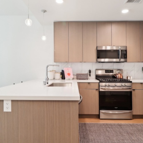 a kitchen with wood cabinets