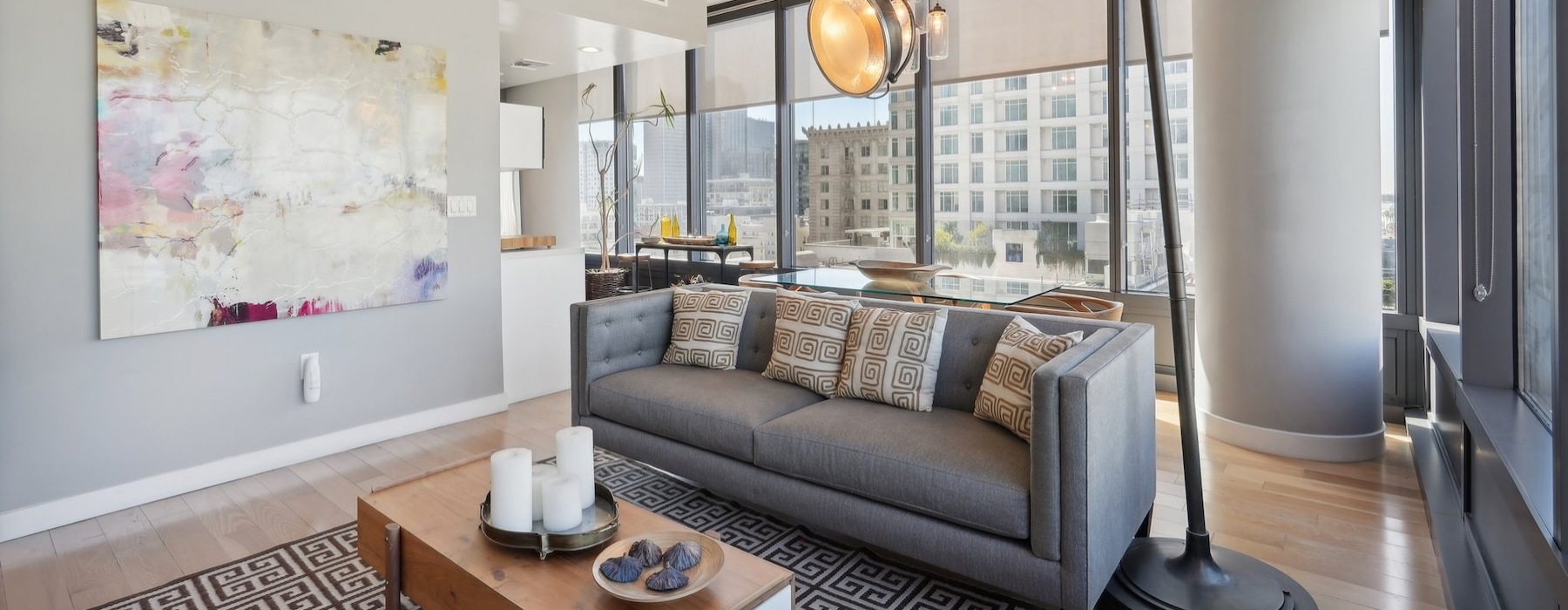 a living room with a large window and a couch