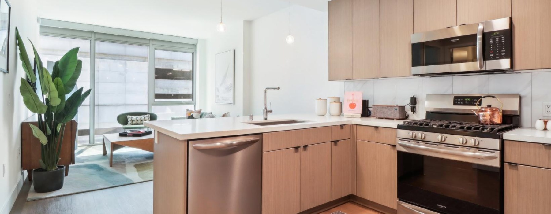 a kitchen with wooden cabinets